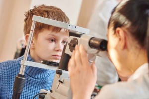  Child Having Eye Exam Inside Mobile Optometry Unit