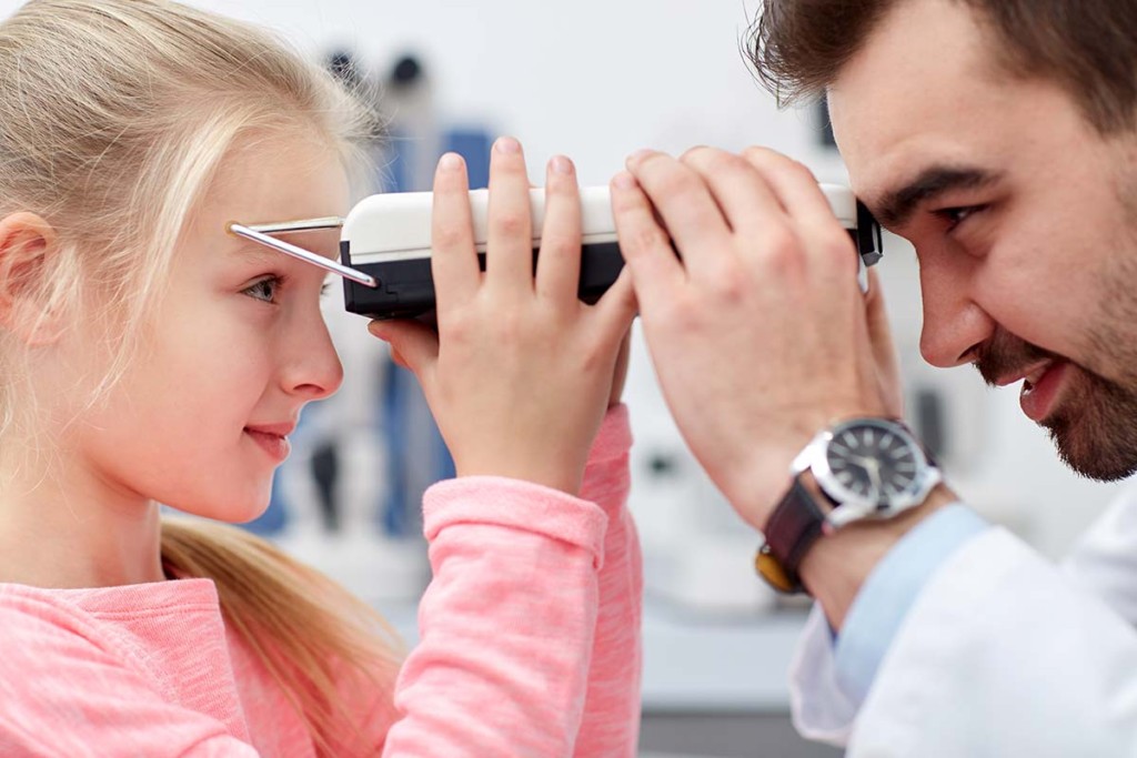 Optometrist With Pupilometer inside Remote Mobile Ophthalmology Facility