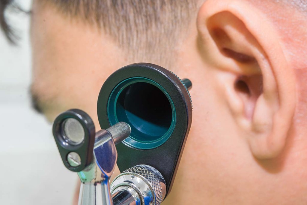  Otoscope On The Ear Of A Patient Inside Mobile Audiology Clinic