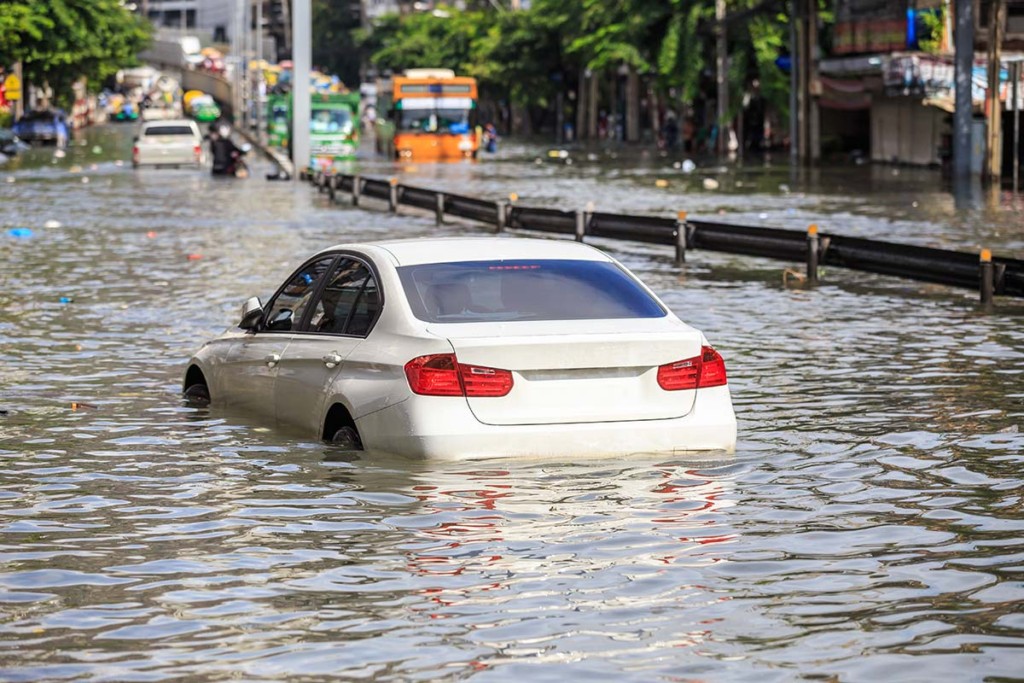  Car On The Street With Water Flooding After Hurricane