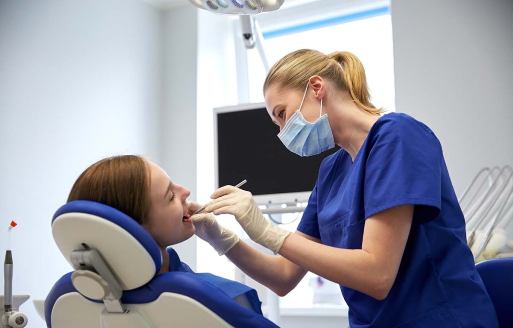 Dentist Checking Patient Teeth Inside Remote Mobile Dental Facility ...