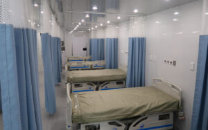 Timor Leste Interior Rear To Front Beds With Blue Curtains Open 